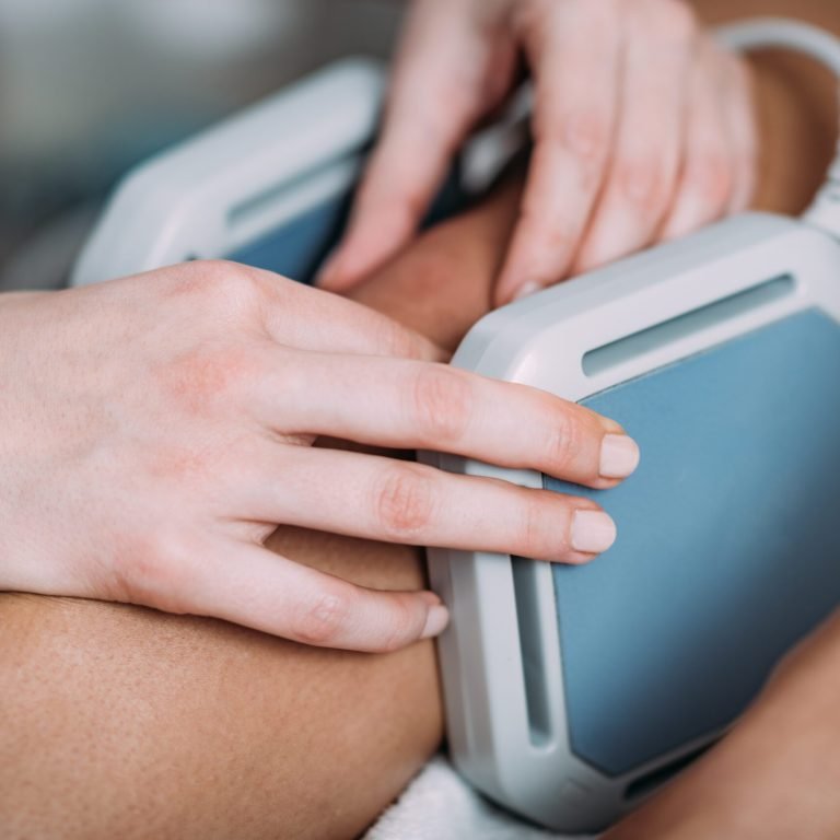 Magnet therapy. Magnets used in physical therapy, placed to patient's knee.